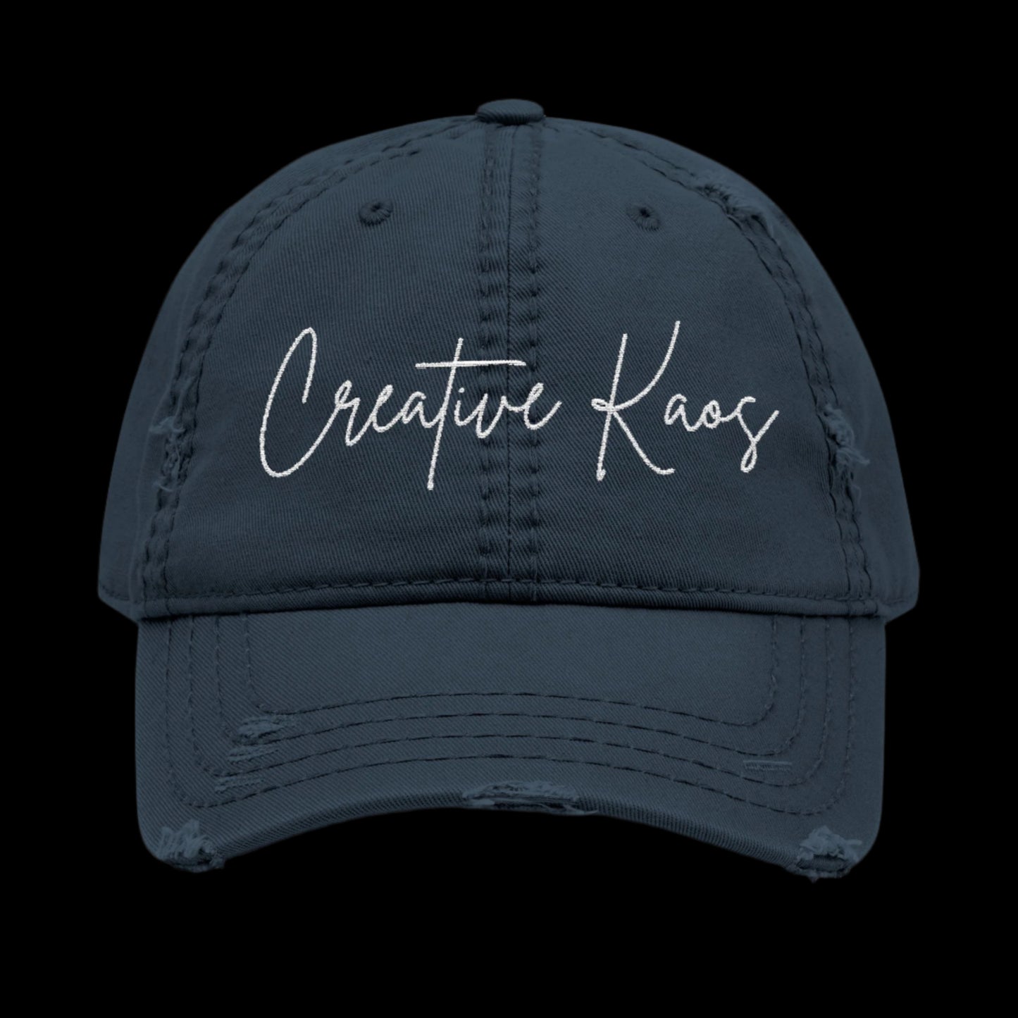 Navy blue cap with 'Creative Kaos' text on a black background